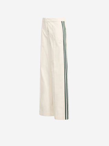 ADIDAS ORIGINALS Pantaloni bianchi in velluto Oktoberfest con dettagli piping Bianco