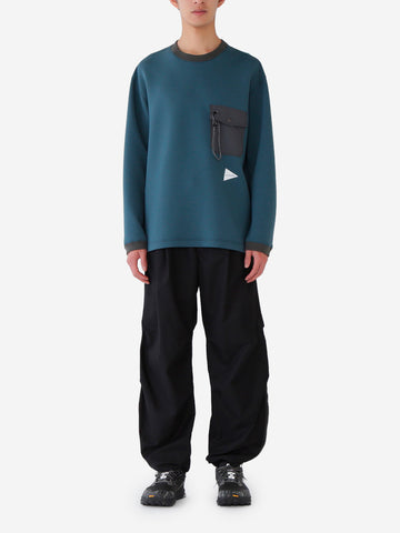 AND WANDER Pantaloni neri High Count con orlo con zip Nero