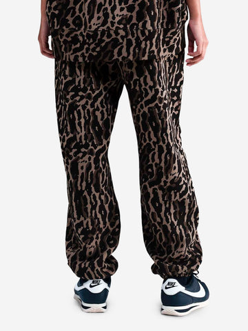 NIKE Pantaloni tuta oversize con stampa leopardata Maculato