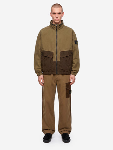 STONE ISLAND Giacca verde militare in cotone con inserti in nylon e logo patch Verde