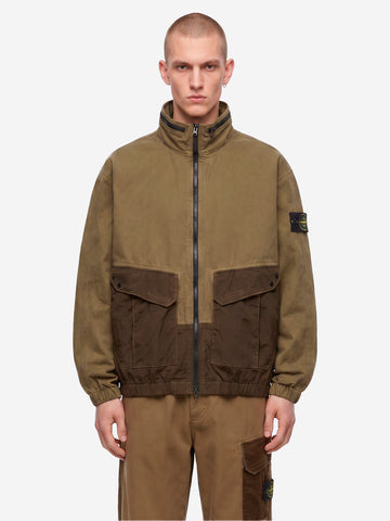 STONE ISLAND Giacca verde militare in cotone con inserti in nylon e logo patch Verde