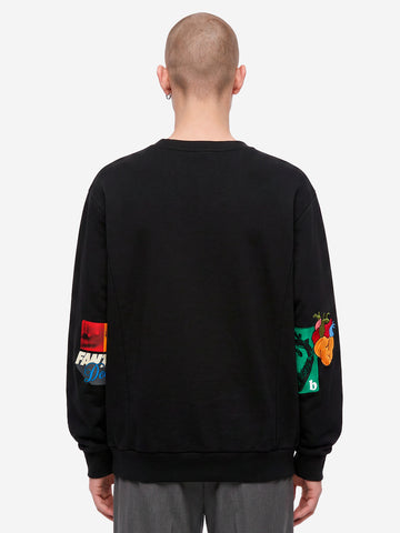 UNDERCOVER Felpa nera ricamata con dettaglio zip Nero