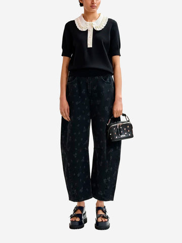ESSENTIEL ANTWERP Polo in maglia sottile nera e avorio con volant e decorazioni in perline Nera bianca