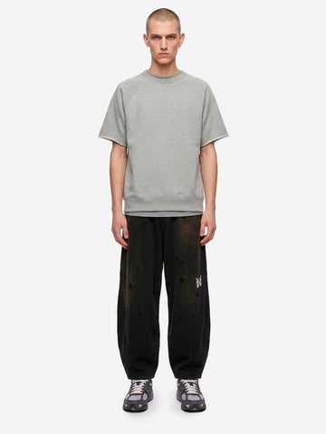 Jogger neri HD decostruiti in french terry e dettagli distressed