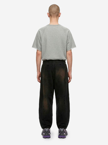 Jogger neri HD decostruiti in french terry e dettagli distressed