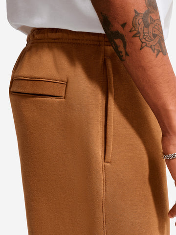 NIKE Pantaloni marroni in fleece con orlo aperto Cammello