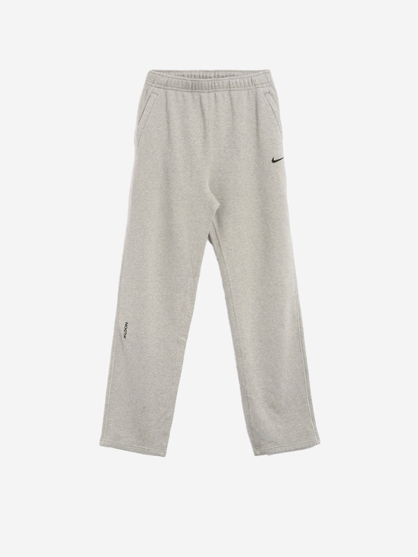 NIKE Gray sweatpants with open hem CS NOCTA x Drake FZ4675