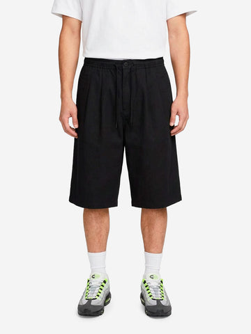 NIKE Shorts oversize neri pleated con Swoosh Nero