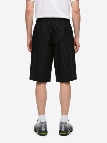 NIKE Shorts oversize neri pleated con Swoosh Nero