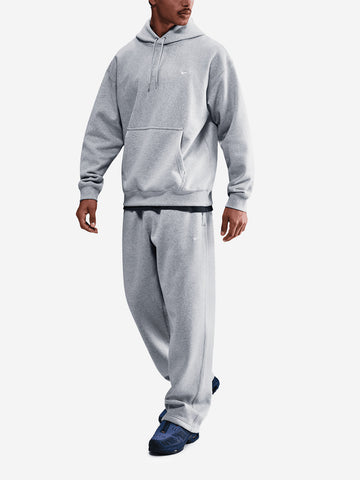 NIKE Pantaloni grigi in fleece con orlo aperto Grigio