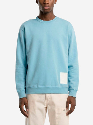 STONE ISLAND Felpa girocollo azzurra in cotone fleece 'Marina' con applicazione riflettente Celeste