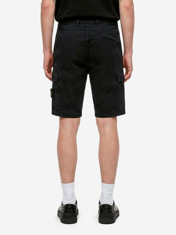 STONE ISLAND Shorts cargo neri slim con cuciture asimmetriche ed effetto old Nero